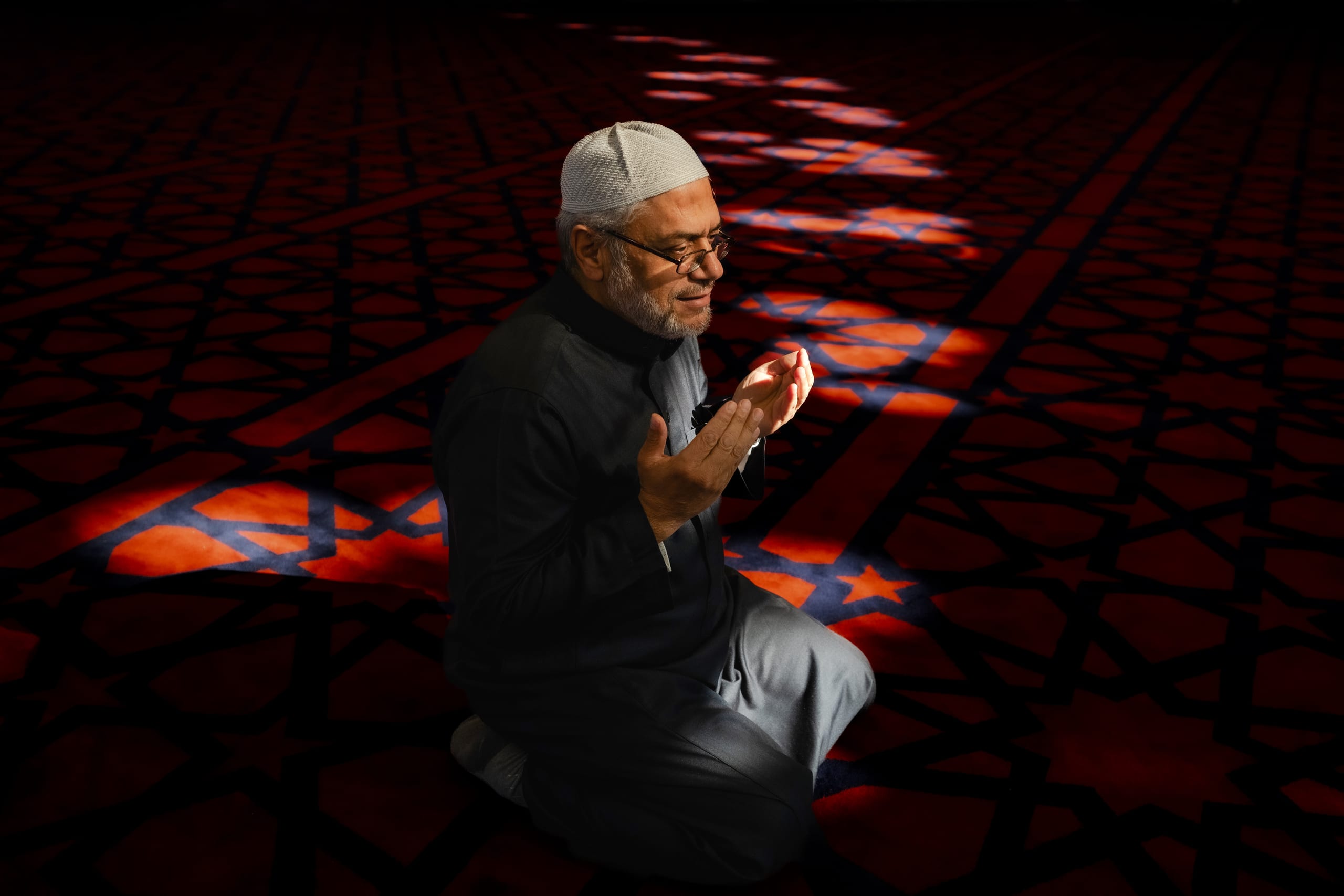 MAN Read Quran Masjid Ramadain, a fine-art photograph by Ali Abu Ras