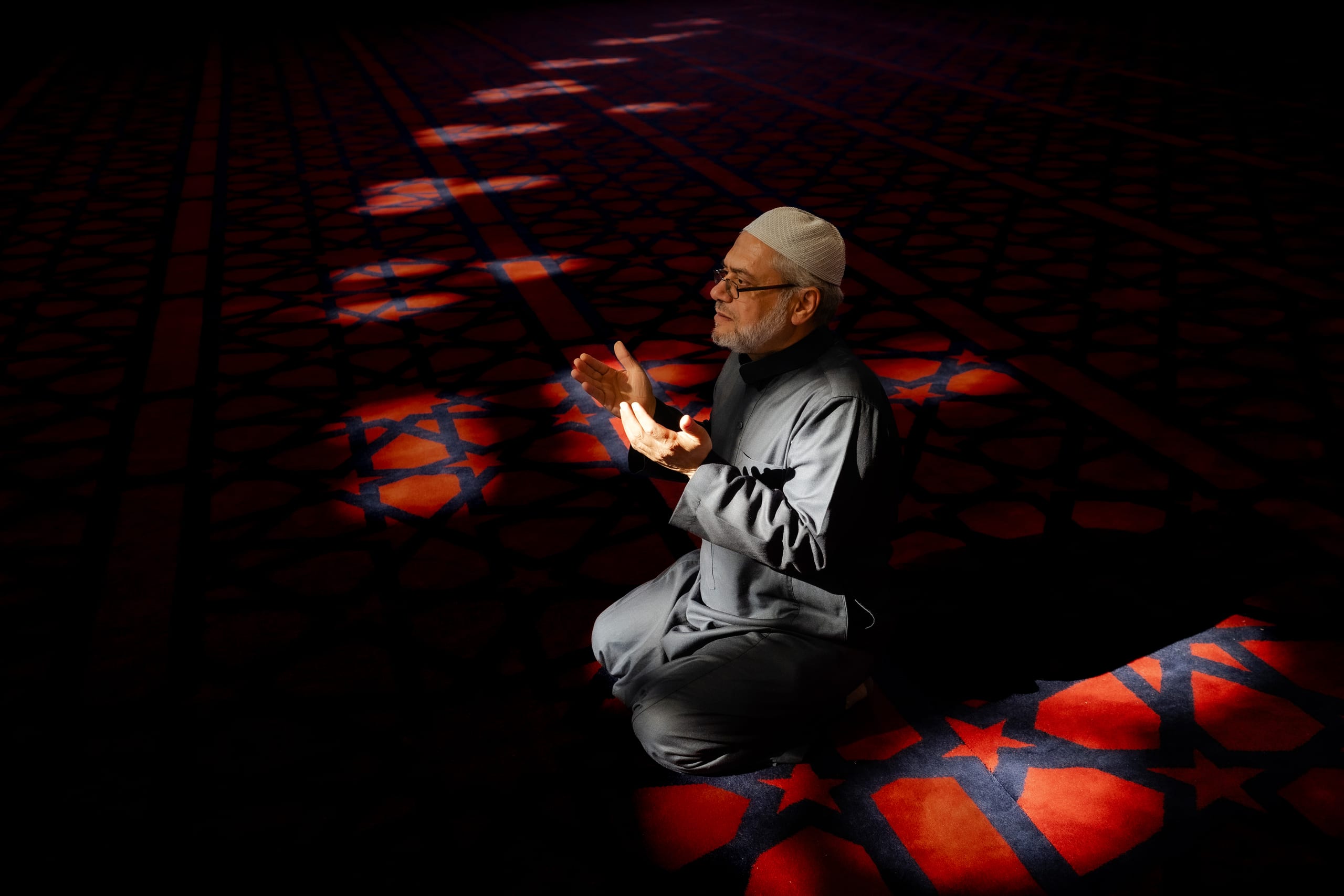 MAN Read Quran Masjid Ramadain, a fine-art photograph by Ali Abu Ras