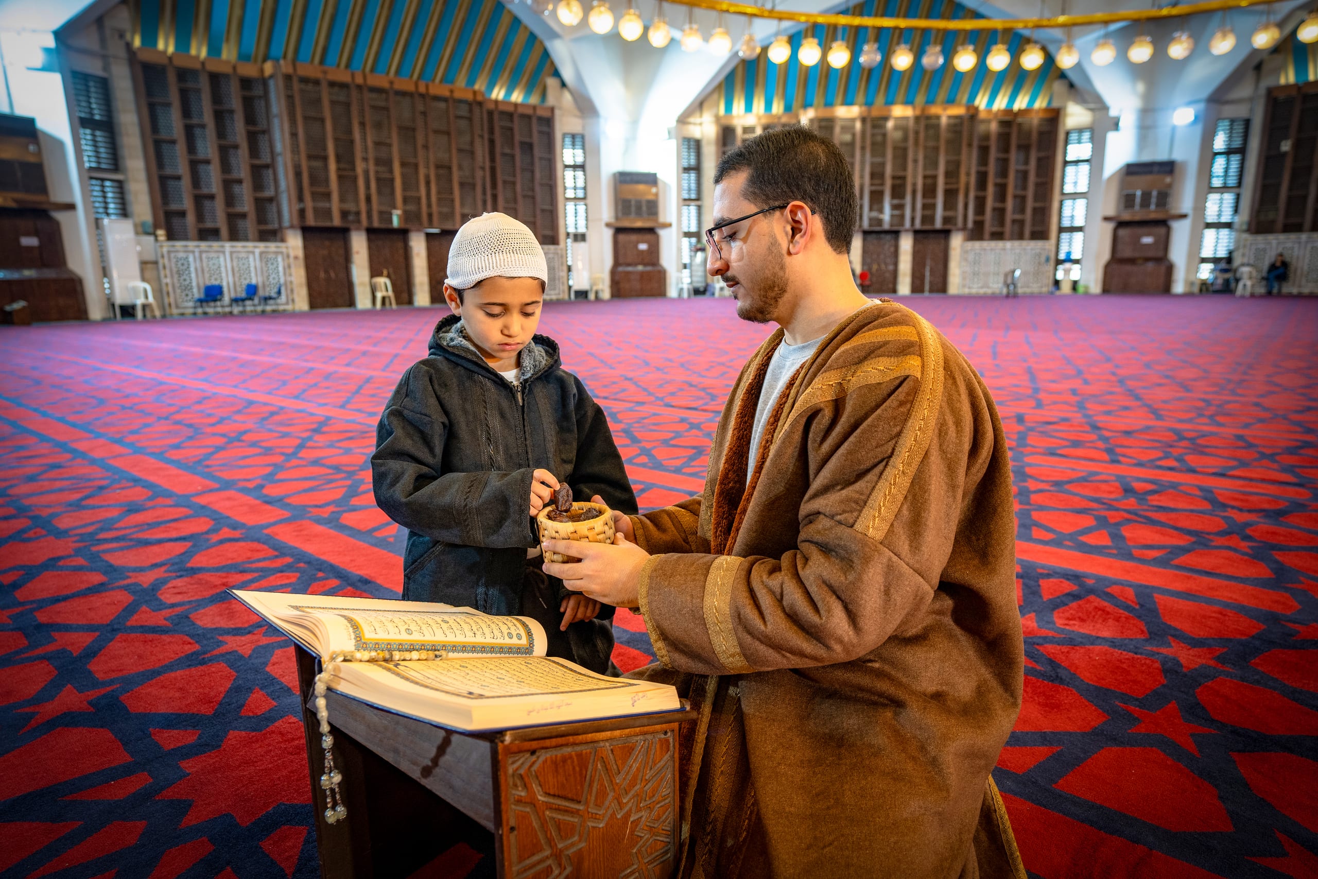 BOY Father Masjed Quran, a fine-art photograph by Ali Abu Ras