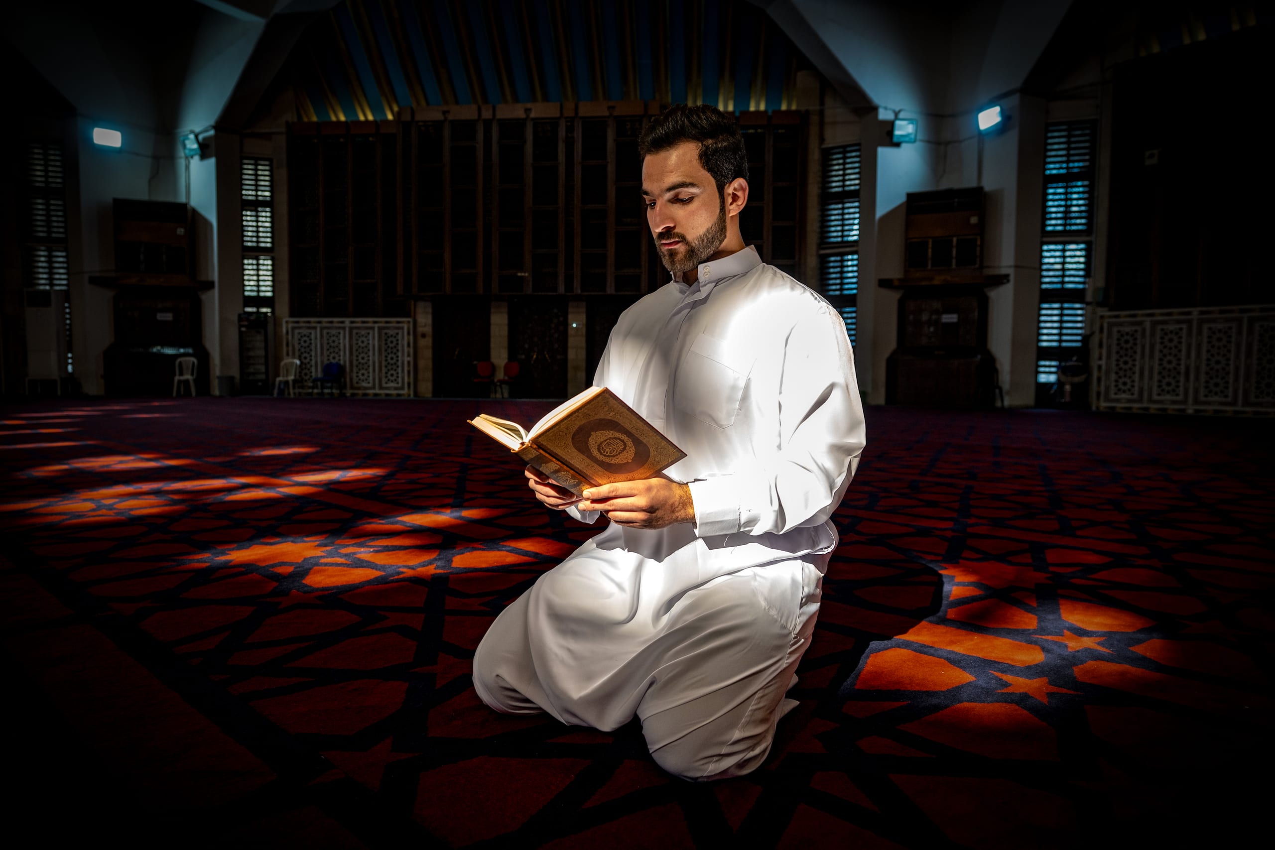 MAN Read Quran Masjid Ramadain, a fine-art photograph by Ali Abu Ras