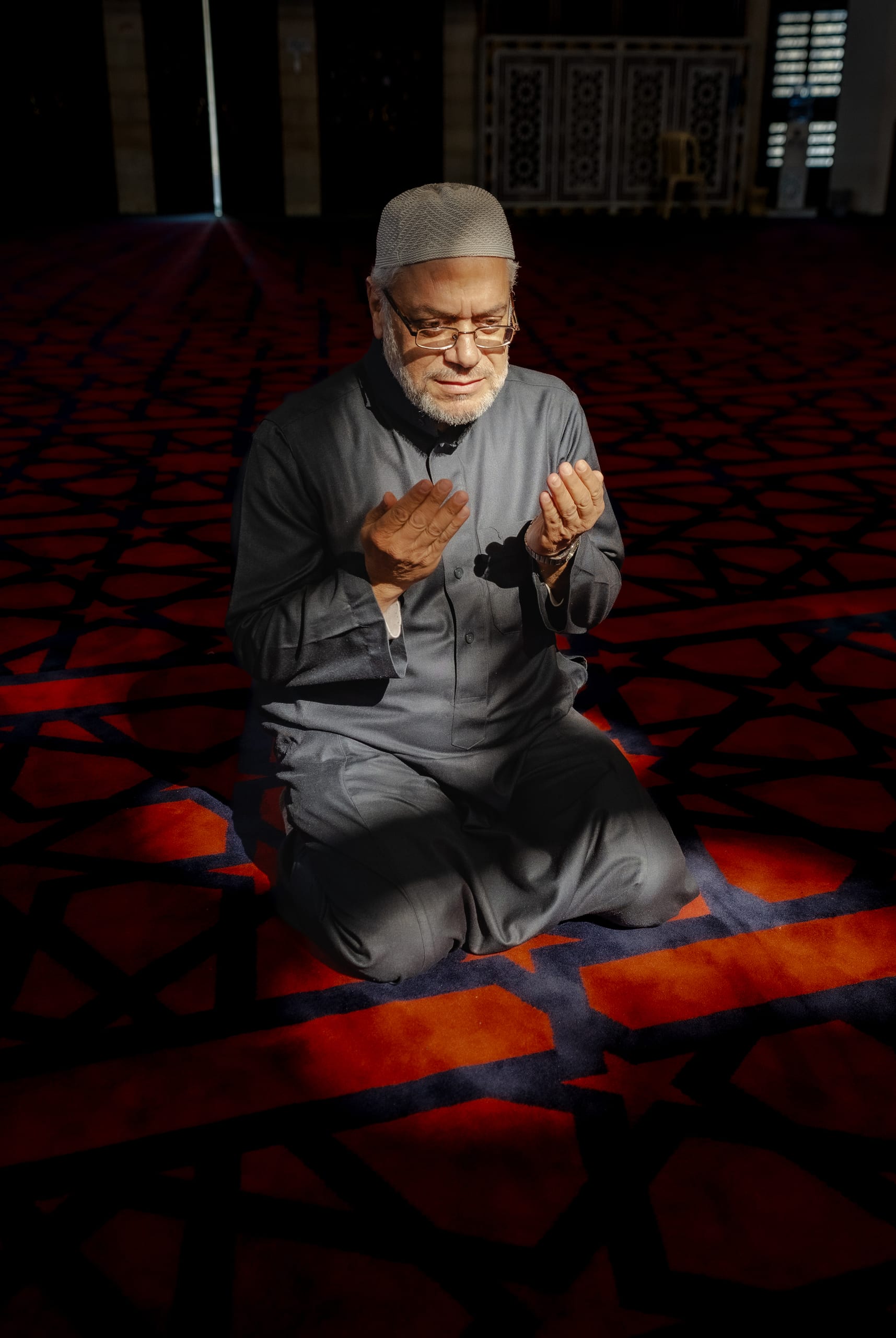 MAN Read Quran Masjid Ramadain, a fine-art photograph by Ali Abu Ras