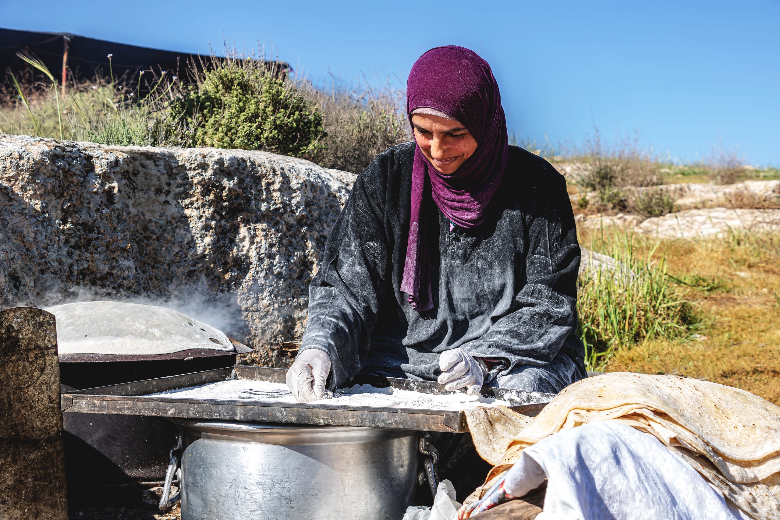 Woman Work Create Bread Outdoor Graesa, a fine-art photograph by Ali Abu Ras