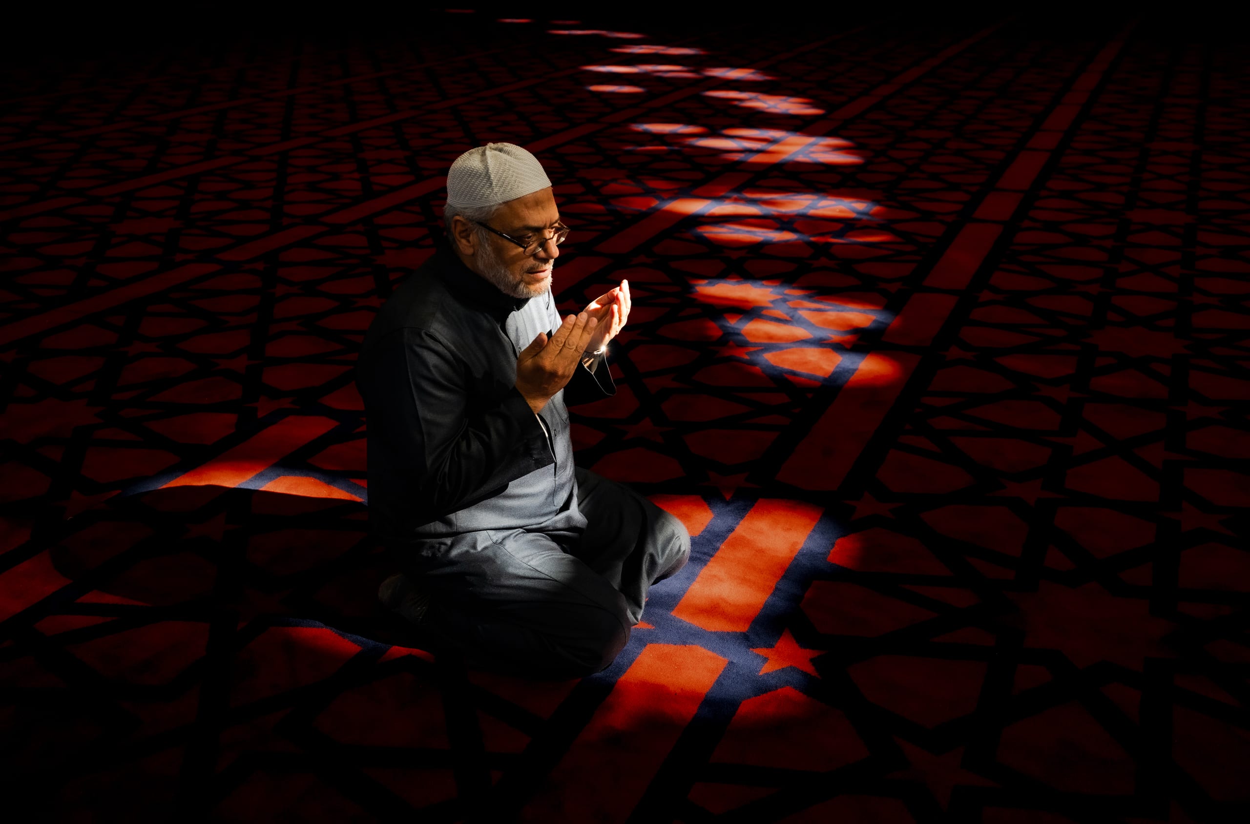 MAN Read Quran Masjid Ramadain, a fine-art photograph by Ali Abu Ras