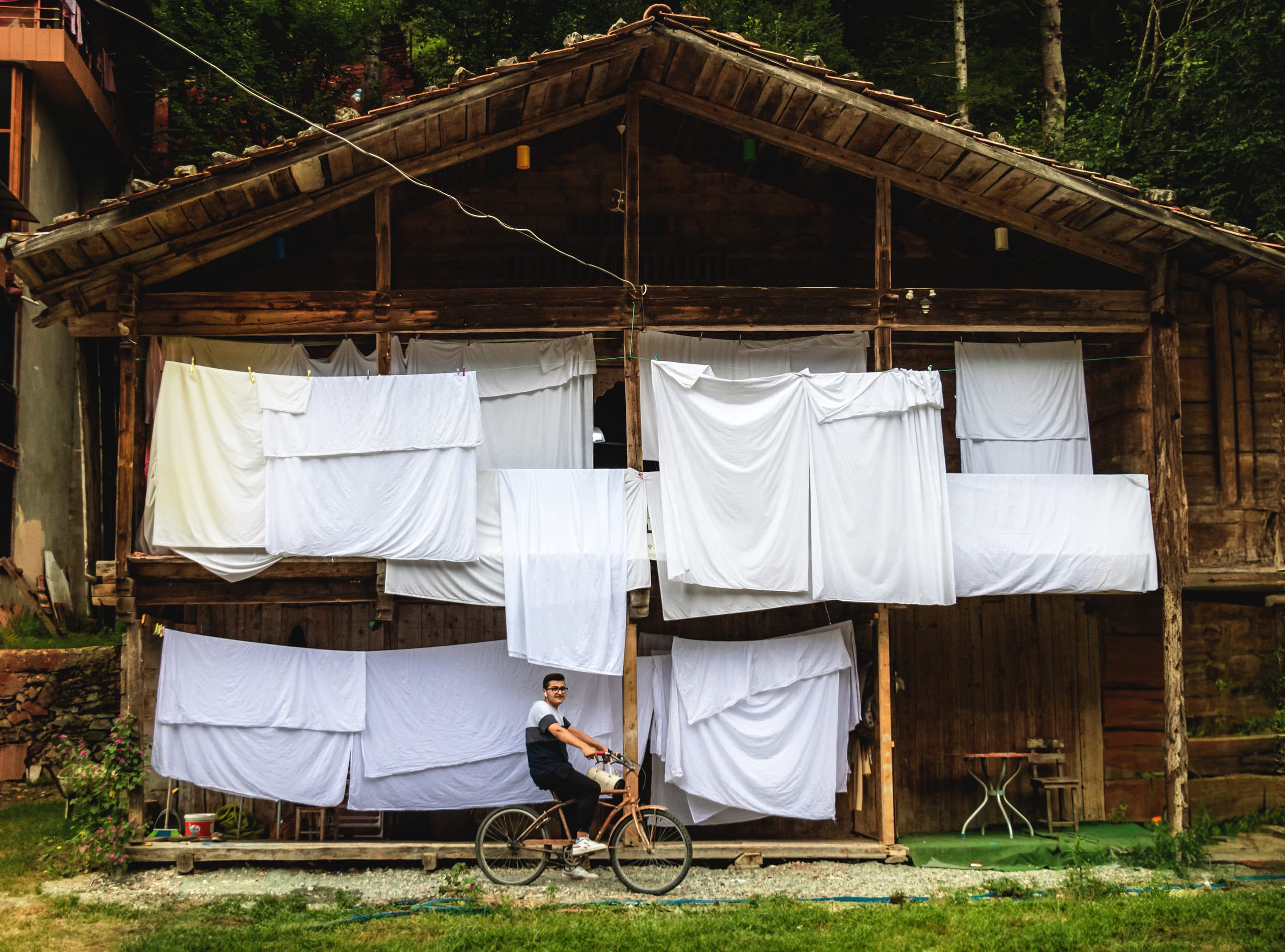 Tarabozon Trees House Landry Bicycle BOY, a fine-art photograph by Ali Abu Ras
