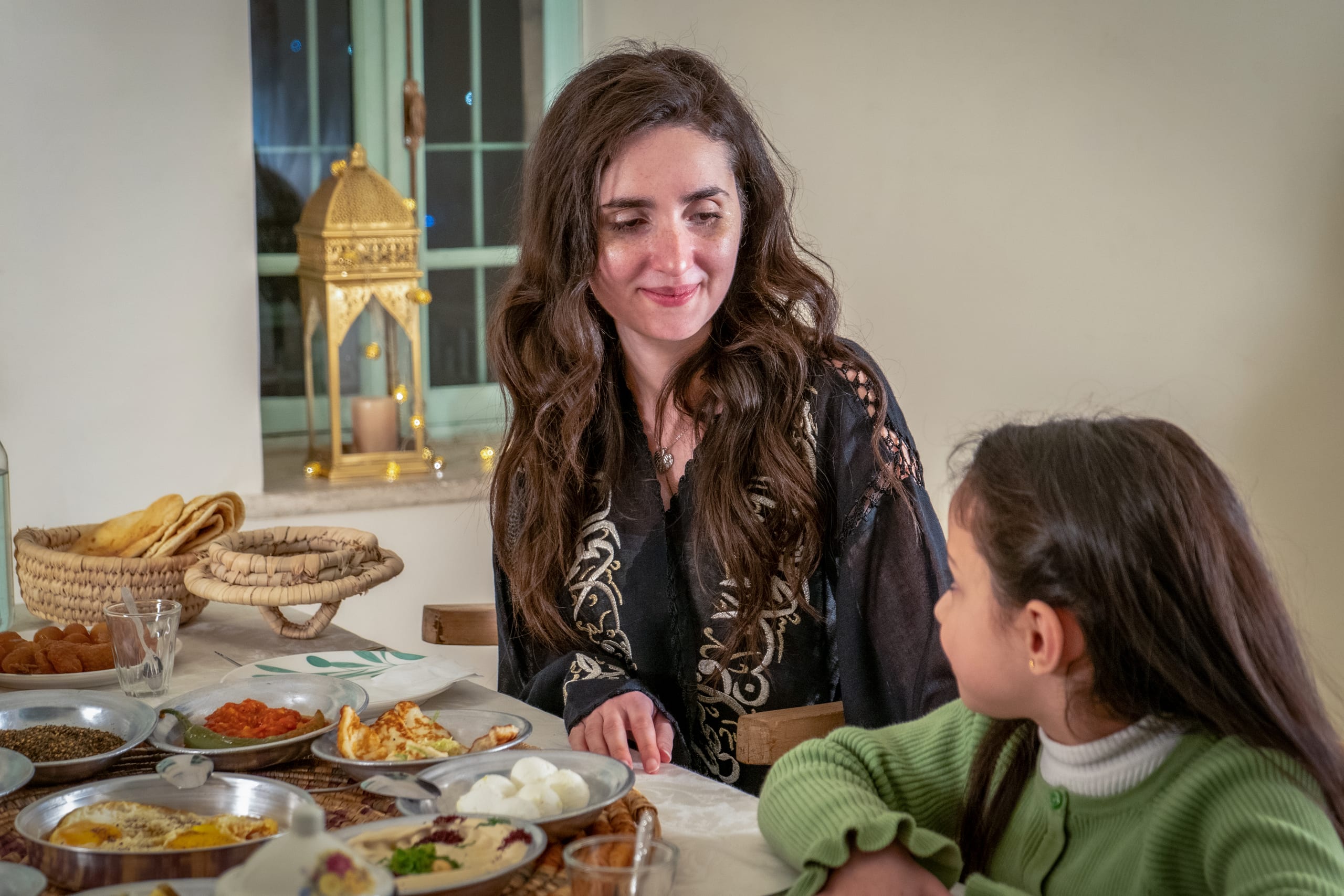 Ramadan Woman Noor Eftar Sohour, a fine-art photograph by Ali Abu Ras