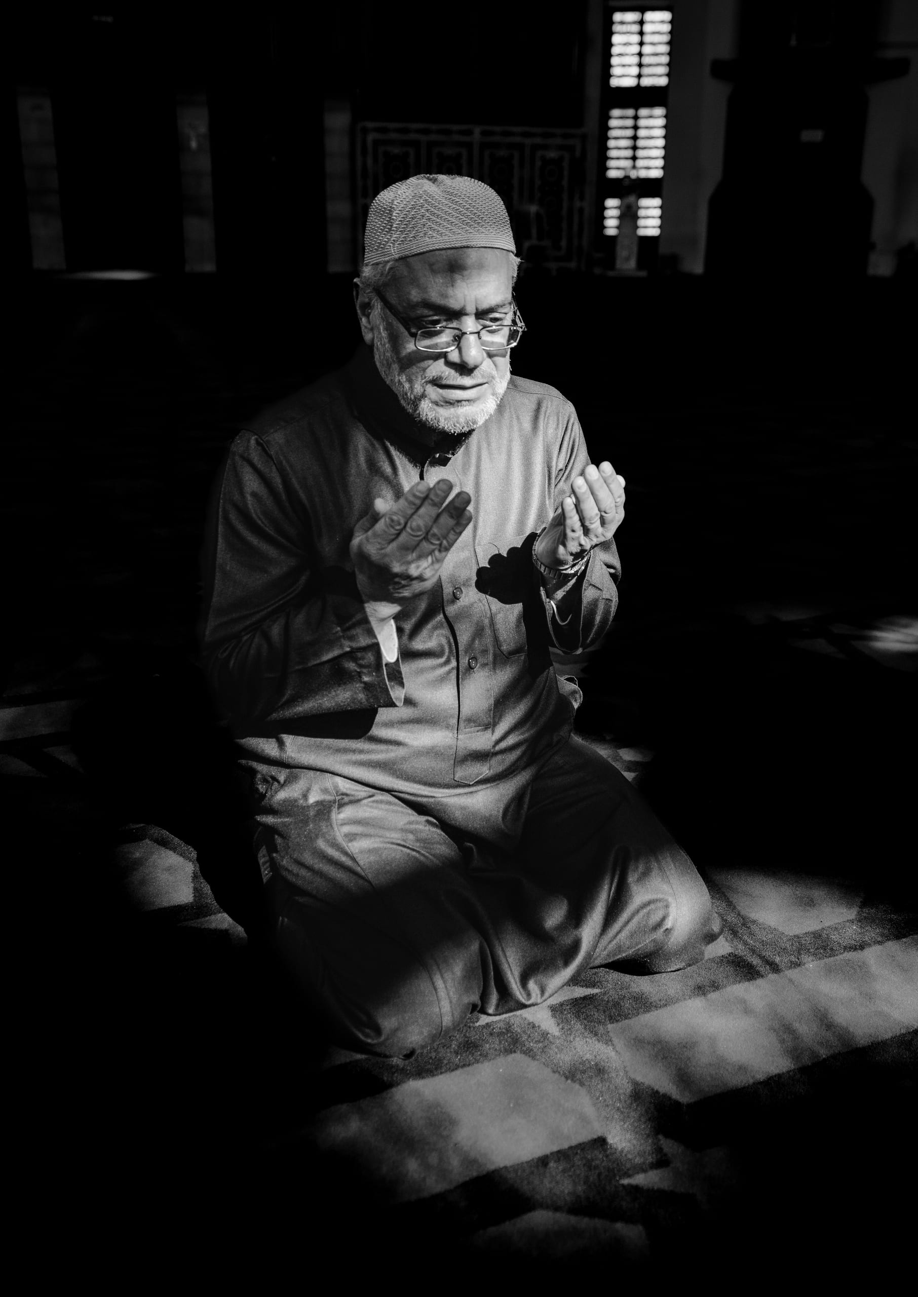 MAN Read Quran Masjid Ramadain, a fine-art photograph by Ali Abu Ras