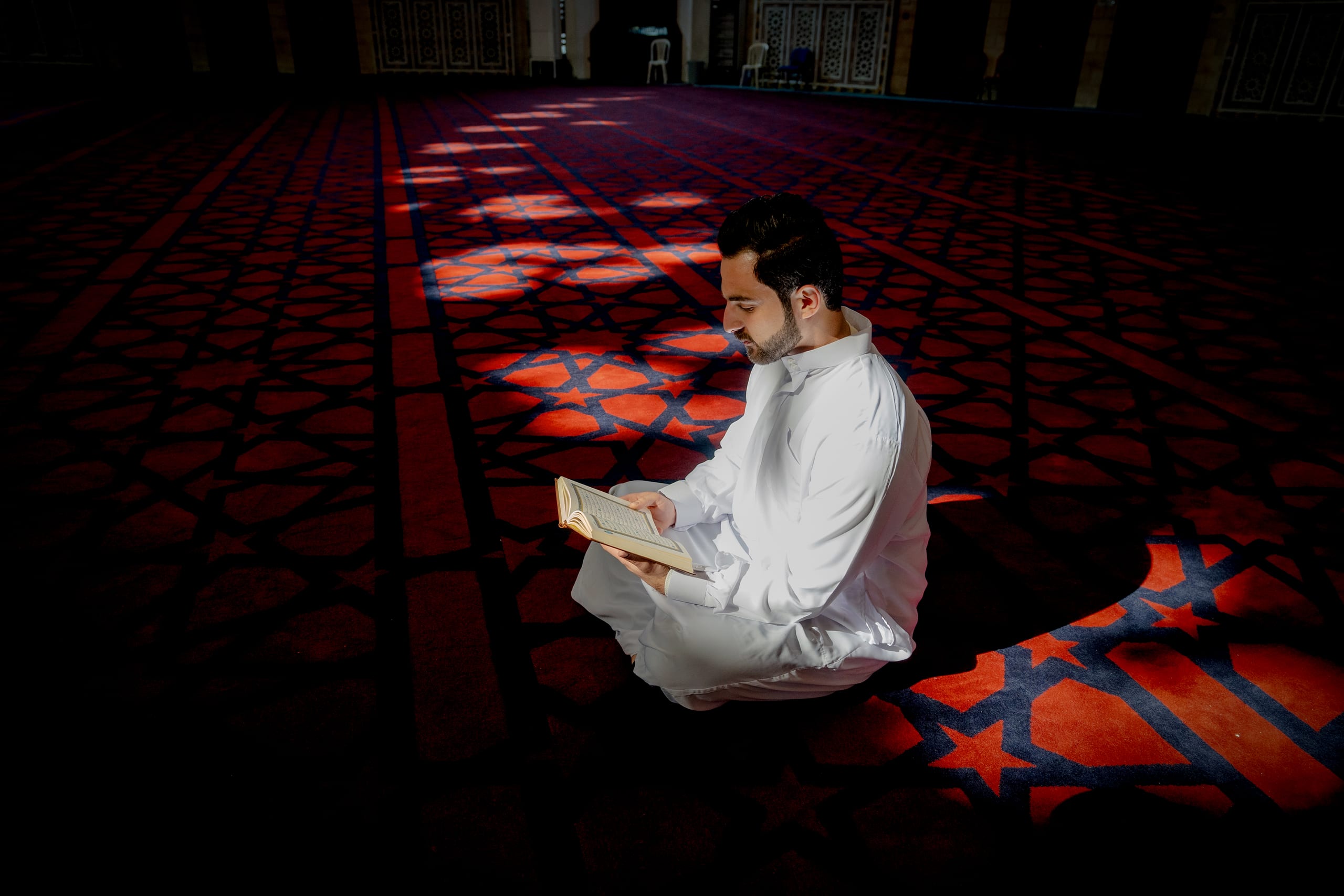 MAN Read Quran Masjid Ramadain, a fine-art photograph by Ali Abu Ras