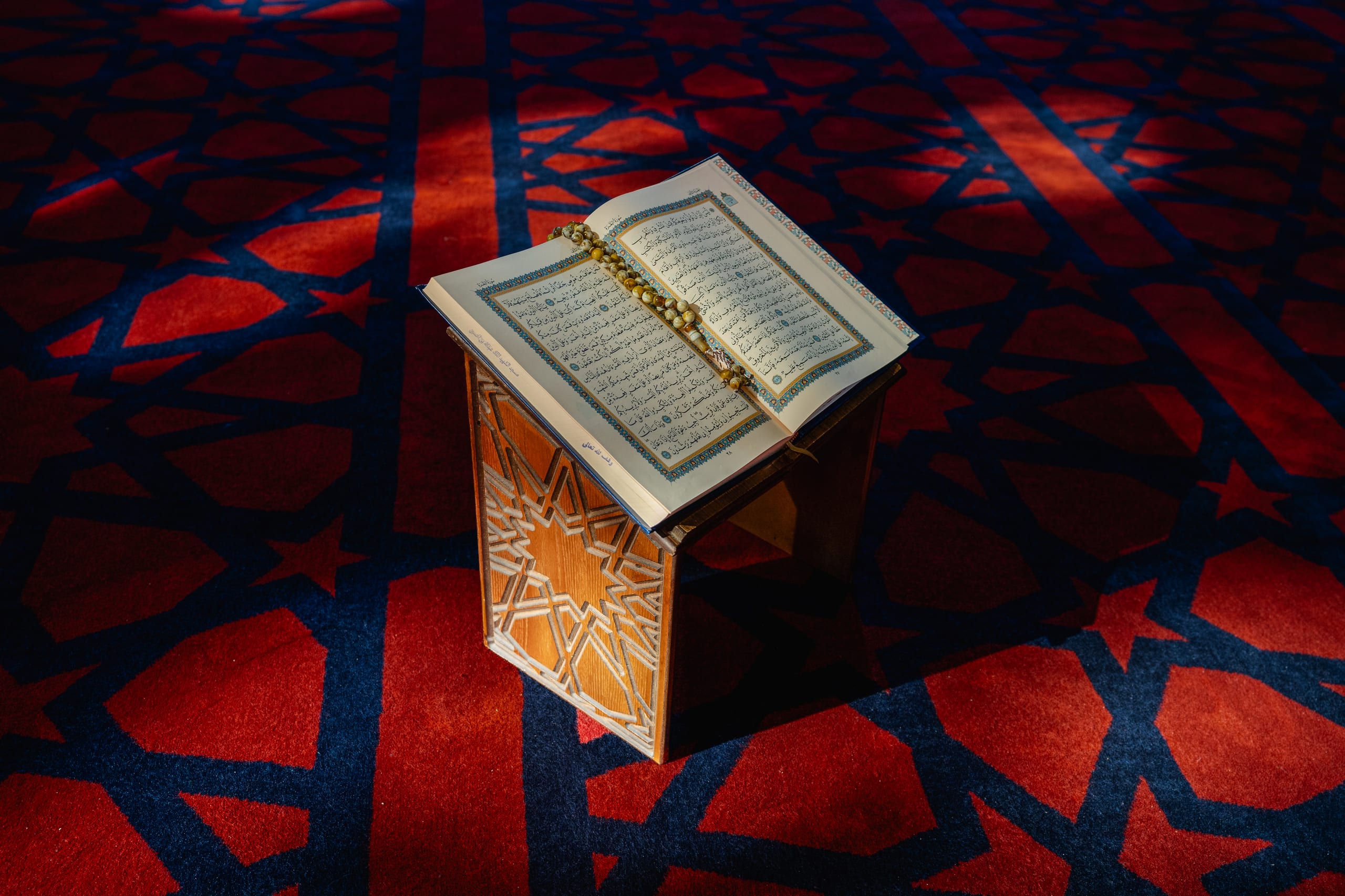 Quran Book Masjed RED, a fine-art photograph by Ali Abu Ras