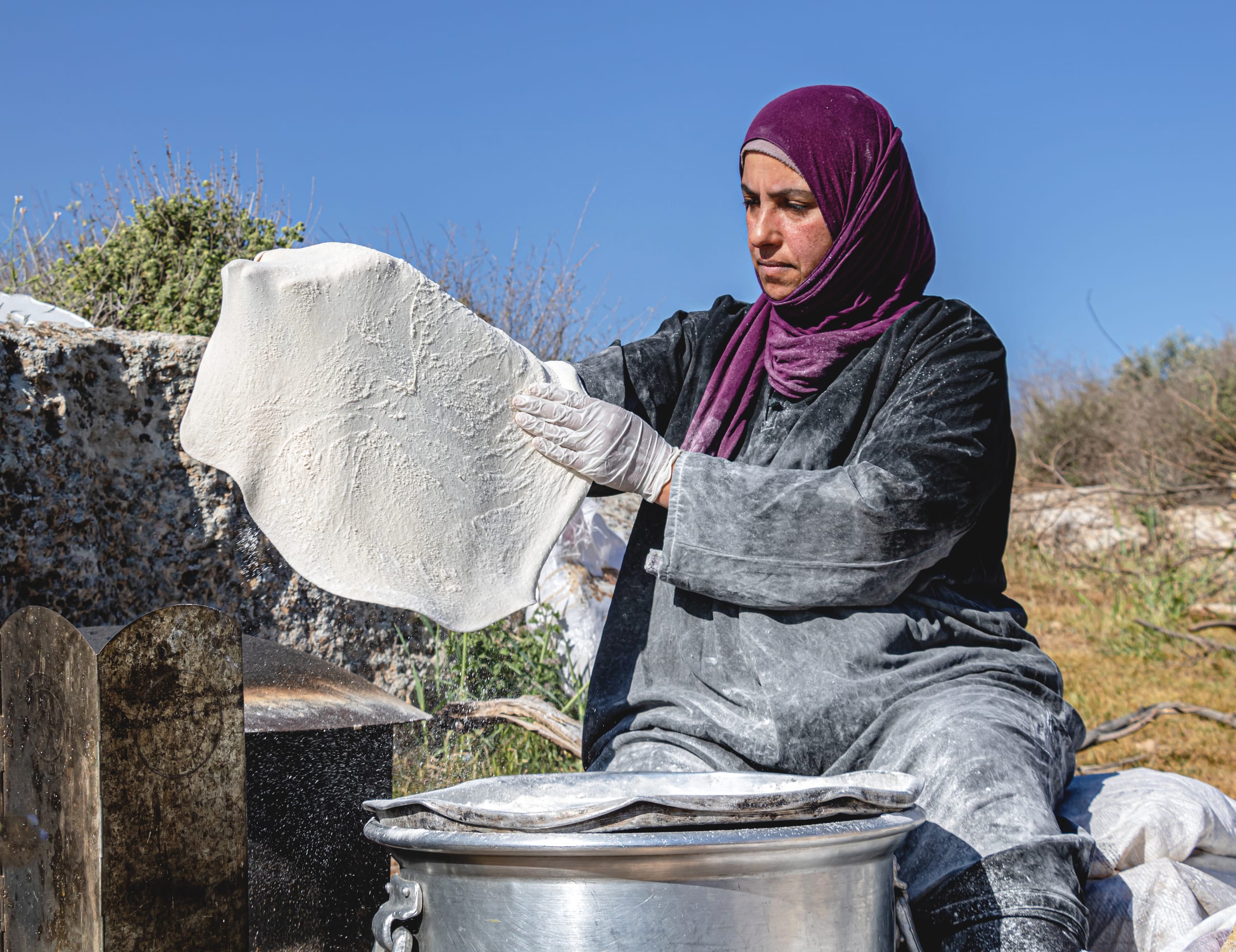 Woman Work Create Bread Outdoor Graesa 4, a fine-art photograph by Ali Abu Ras