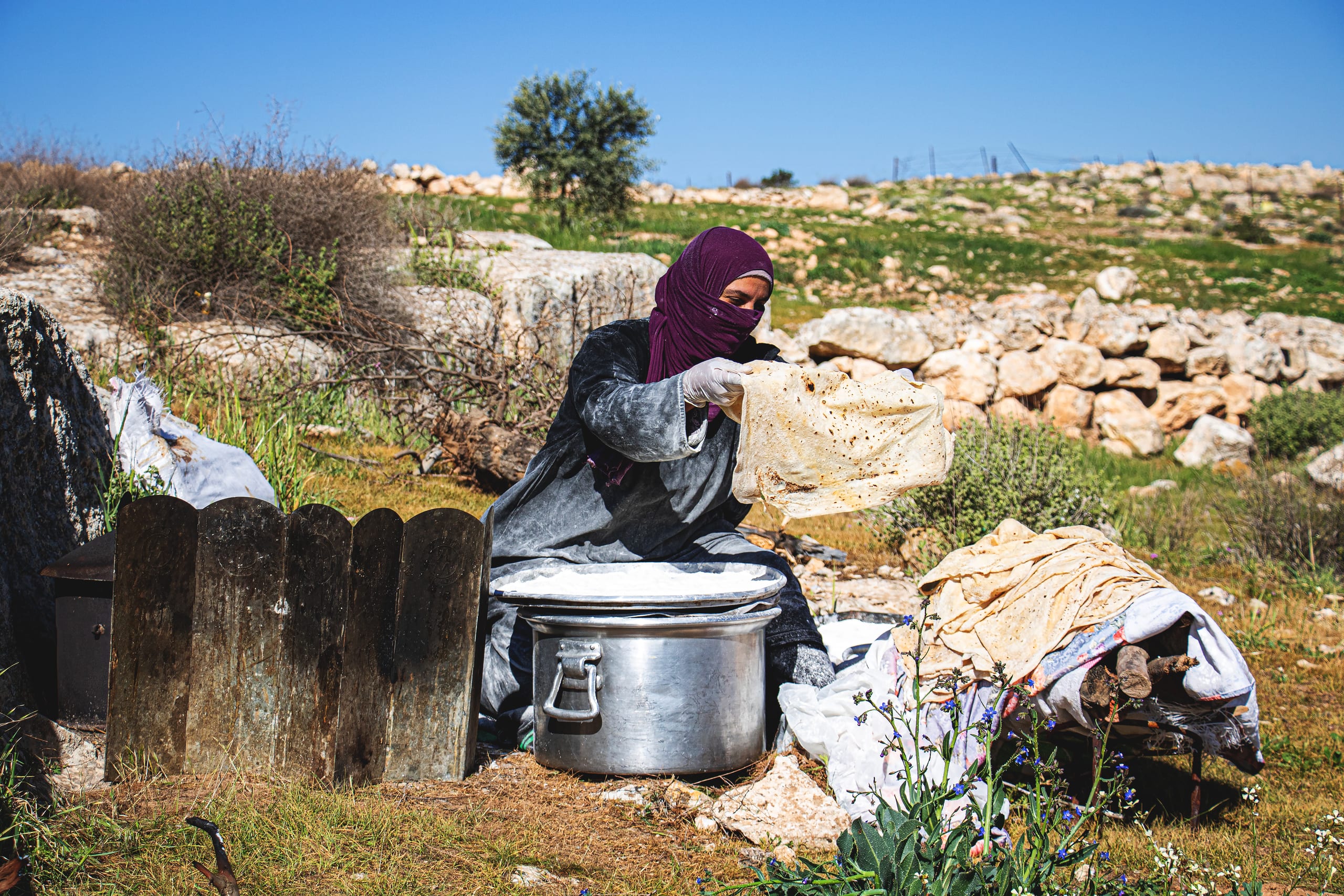 Woman Work Create Bread Outdoor Graesa, a fine-art photograph by Ali Abu Ras