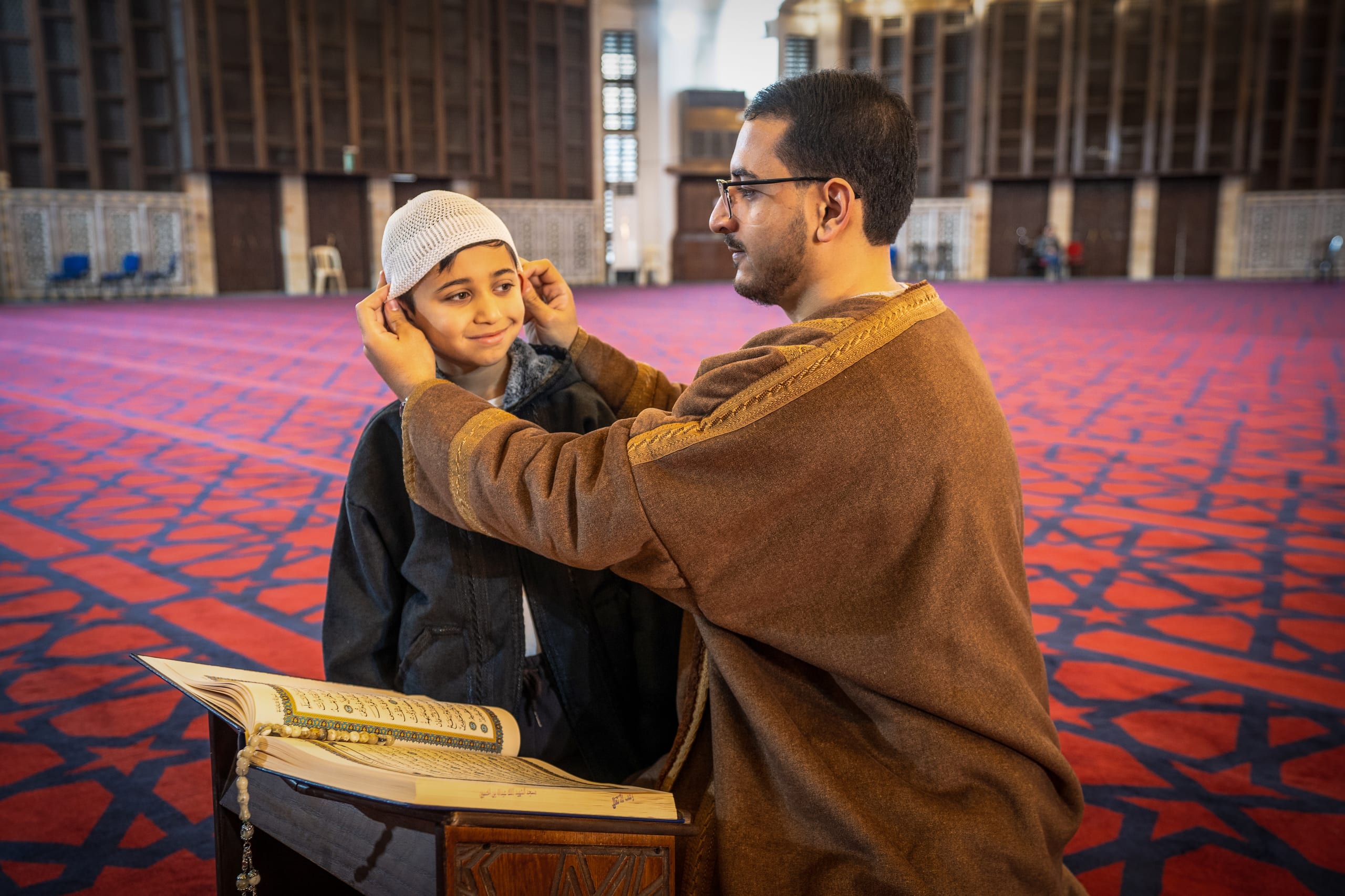 BOY Father Masjed Quran, a fine-art photograph by Ali Abu Ras