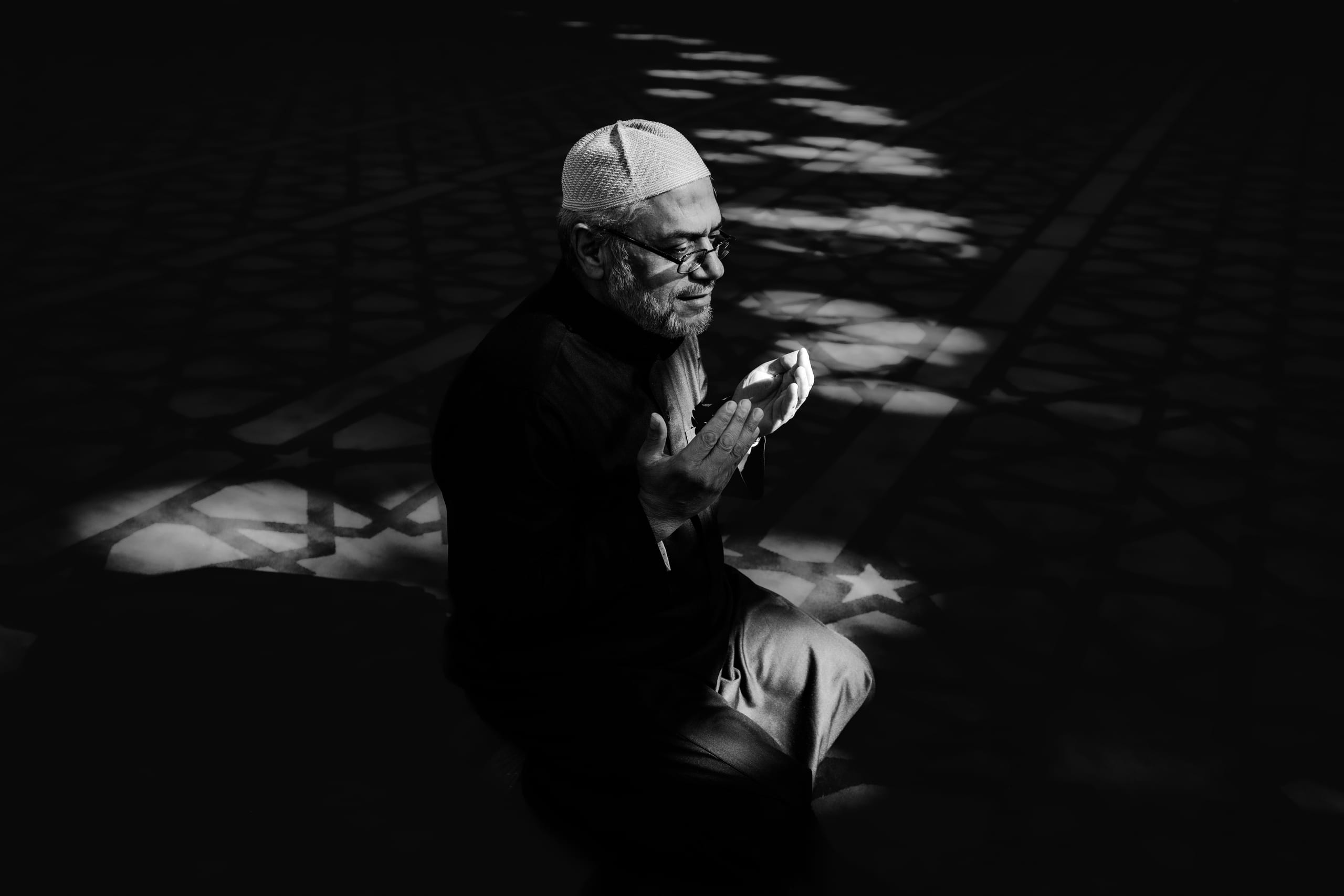 MAN Read Quran Masjid Ramadain, a fine-art photograph by Ali Abu Ras
