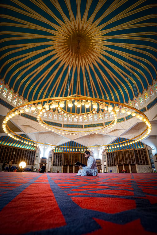 MAN Read Quran Masjid Ramadain Sunlight, a fine-art photograph by Ali Abu Ras