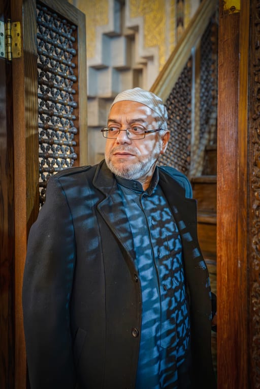 MAN OLD Masjed Pray, a fine-art photograph by Ali Abu Ras