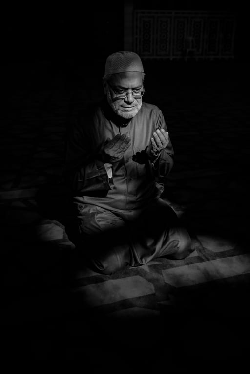 MAN Read Quran Masjid Ramadain, a fine-art photograph by Ali Abu Ras