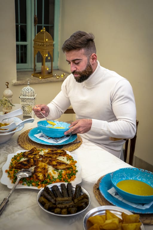 Ramadan MAN EAT Eftar, a fine-art photograph by Ali Abu Ras