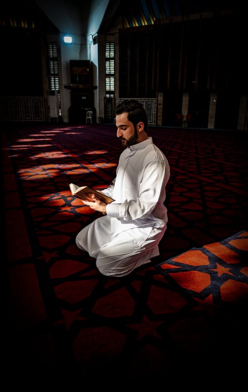 MAN Read Quran Masjid Ramadain, a fine-art photograph by Ali Abu Ras
