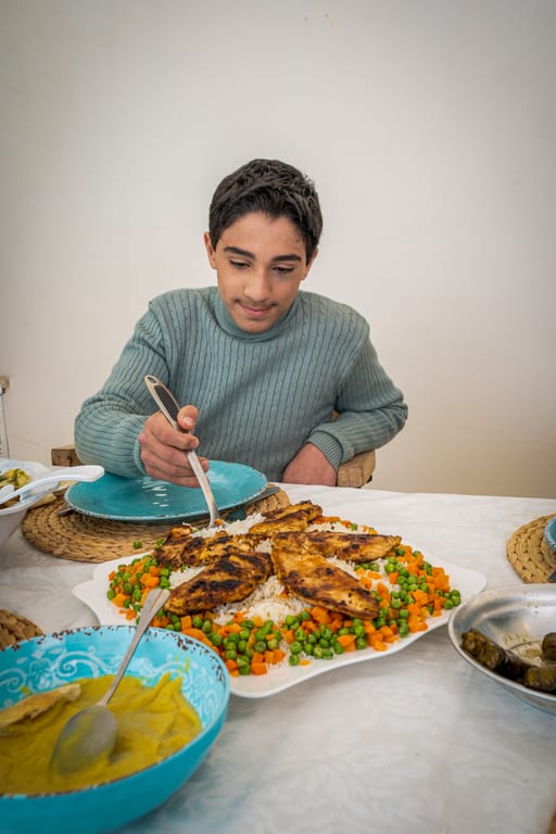 Family Ramadan Eftar Food Eating, a fine-art photograph by Ali Abu Ras