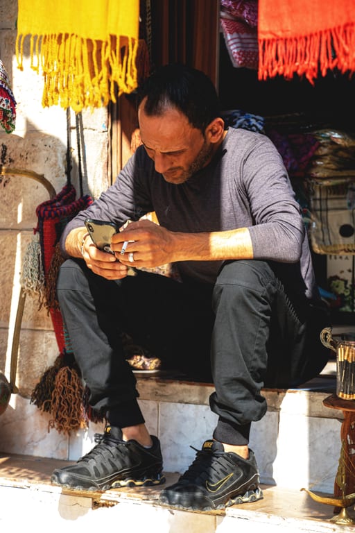 Madaba Woman Visitors Market, a fine-art photograph by Ali Abu Ras