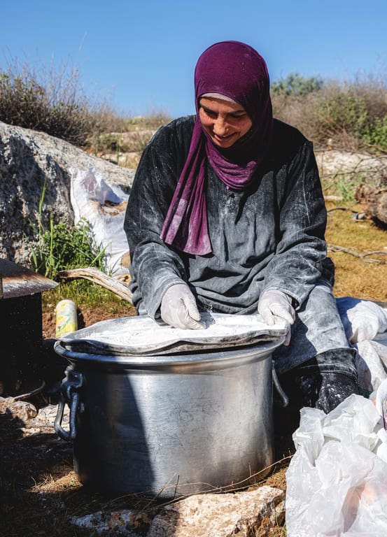 Woman Work Create Bread Outdoor Graesa, a fine-art photograph by Ali Abu Ras
