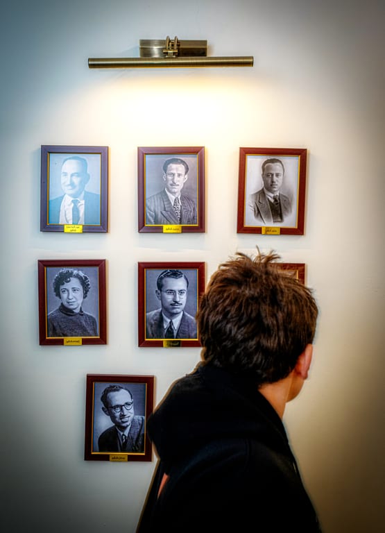 A BOY Walk Front Wall With Picuter Frames, a fine-art photograph by Ali Abu Ras