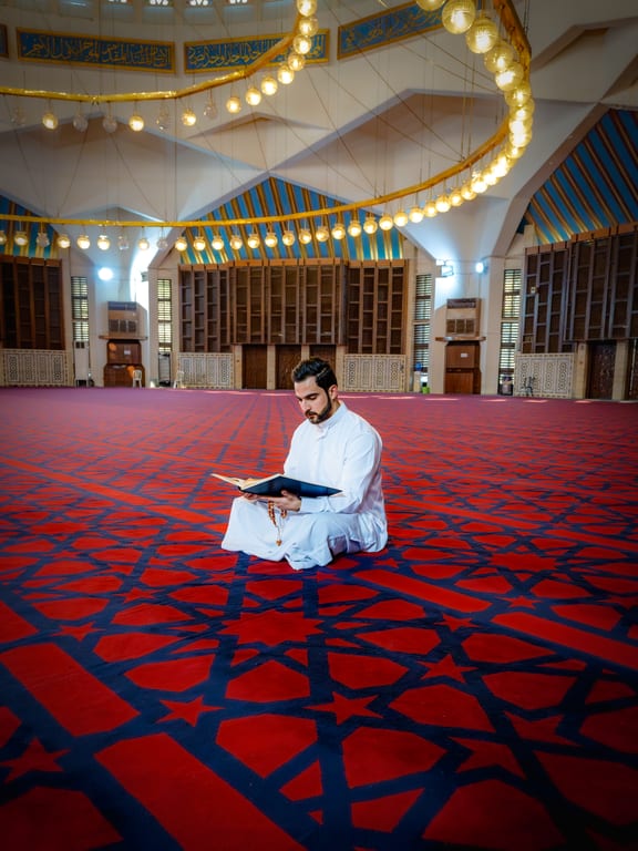 MAN Read Quran Masjid Ramadain Sunlight, a fine-art photograph by Ali Abu Ras