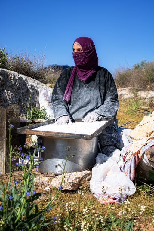 Woman Work Create Bread Garesa, a fine-art photograph by Ali Abu Ras