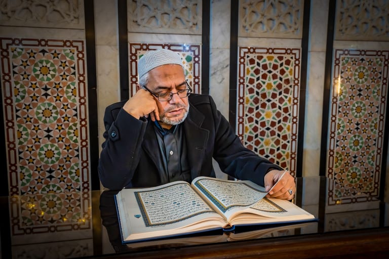 MAN Read Quran Masjid Ramadain Sunlight, a fine-art photograph by Ali Abu Ras