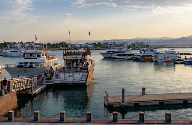 Aqaba Marina SEA Sunset Ships, a fine-art photograph by Ali Abu Ras