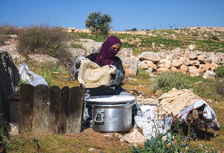 Woman Work Create Bread Outdoor Graesa, a fine-art photograph by Ali Abu Ras