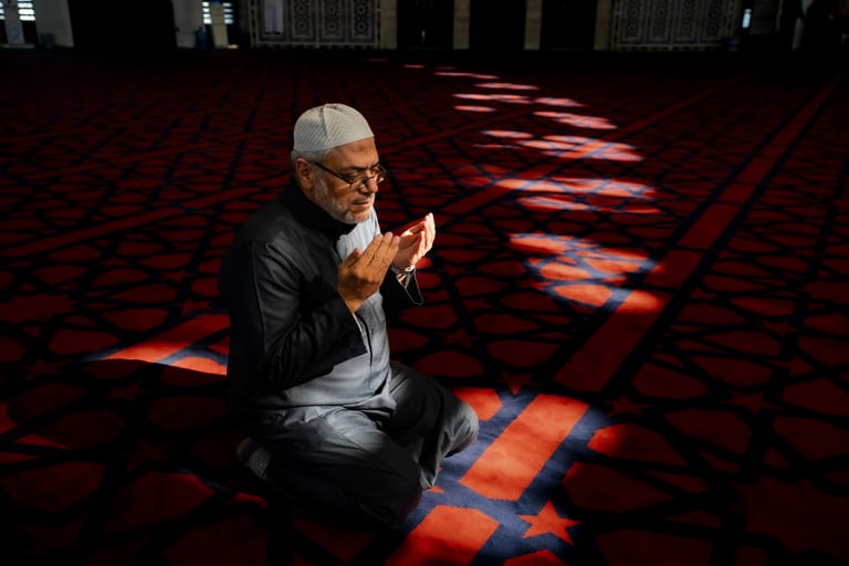 MAN Read Quran Masjid Ramadain, a fine-art photograph by Ali Abu Ras