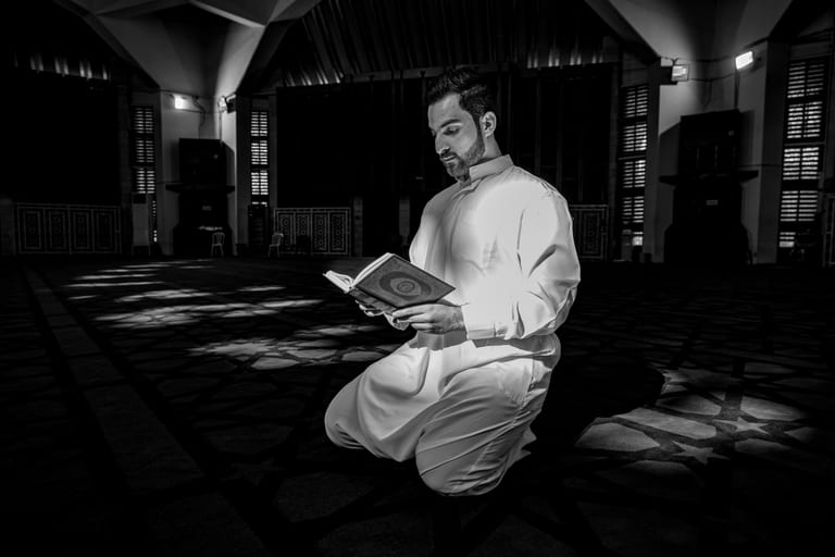 MAN Read Quran Masjid Ramadain, a fine-art photograph by Ali Abu Ras