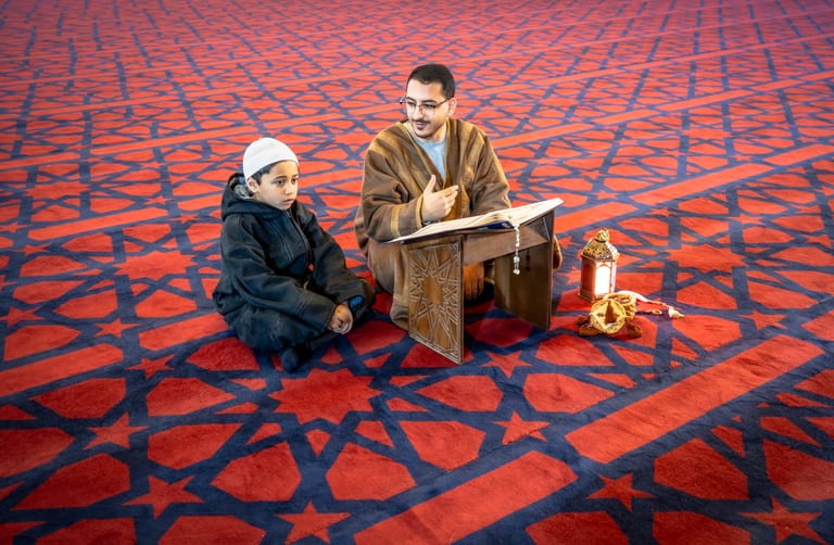BOY Father Masjed Quran, a fine-art photograph by Ali Abu Ras
