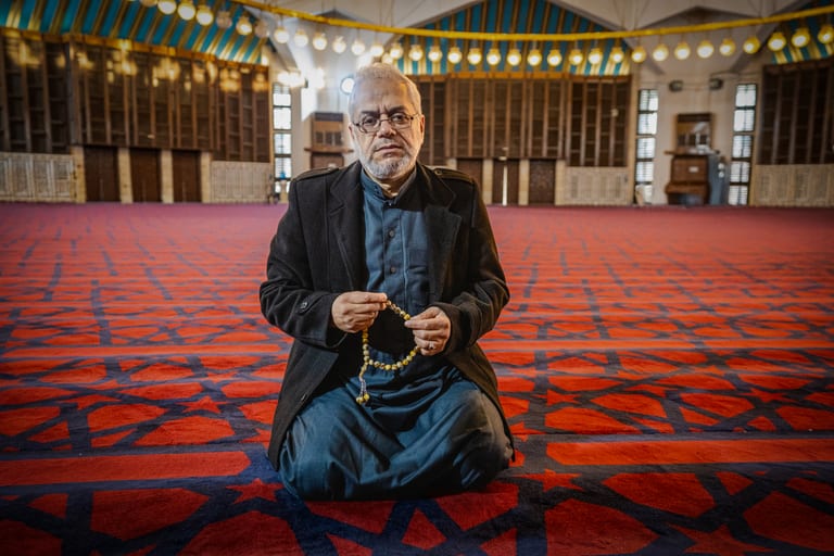 MAN OLD Masjed Pray, a fine-art photograph by Ali Abu Ras