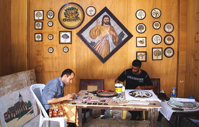 Madaba Street Store People, a fine-art photograph by Ali Abu Ras