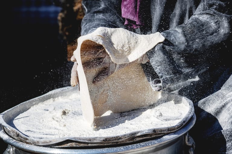 Woman Work Create Bread Outdoor Graesa, a fine-art photograph by Ali Abu Ras