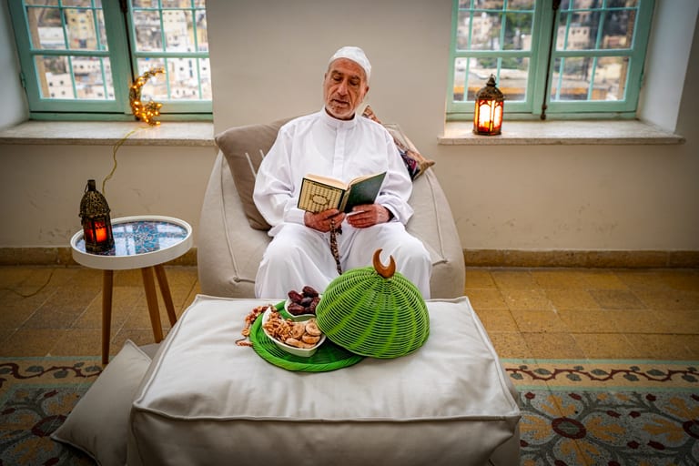 MAN OLD Read Quran Ramadan City Background, a fine-art photograph by Ali Abu Ras