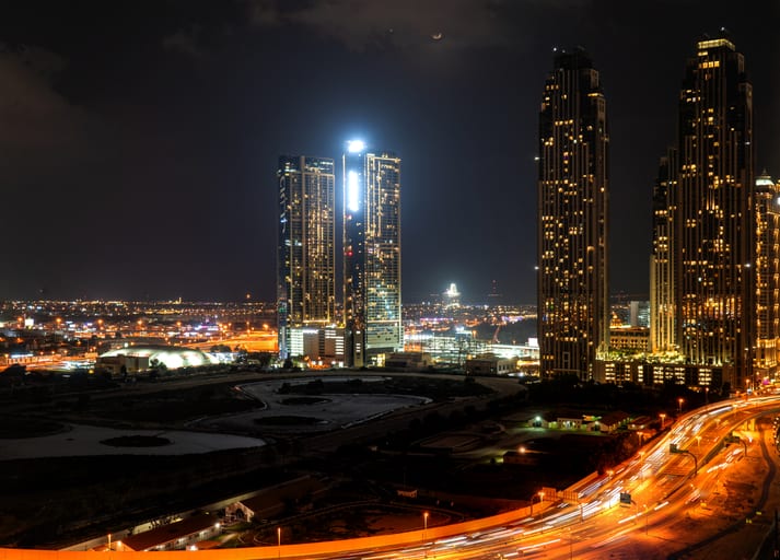 Dubai Building Night Street, a fine-art photograph by Ali Abu Ras