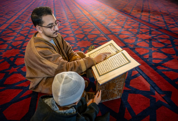 BOY Father Masjed Quran, a fine-art photograph by Ali Abu Ras