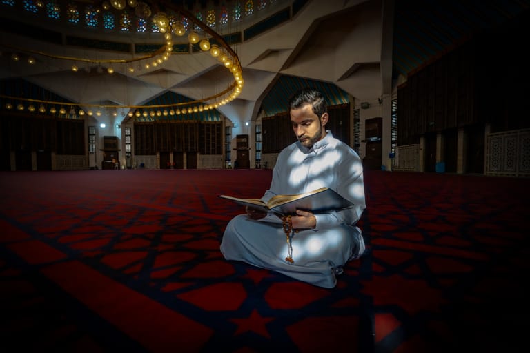 MAN Read Quran Masjid Ramadain Sunlight, a fine-art photograph by Ali Abu Ras