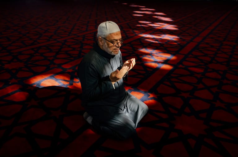 MAN Read Quran Masjid Ramadain, a fine-art photograph by Ali Abu Ras