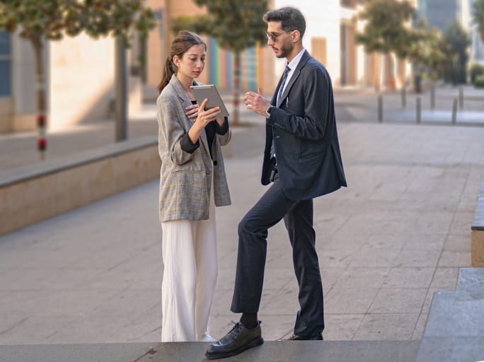 MAN Woman Ipad Standing, a fine-art photograph by Ali Abu Ras