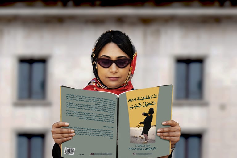 Woman Read Magazen Building Glasses, a fine-art photograph by Ali Abu Ras