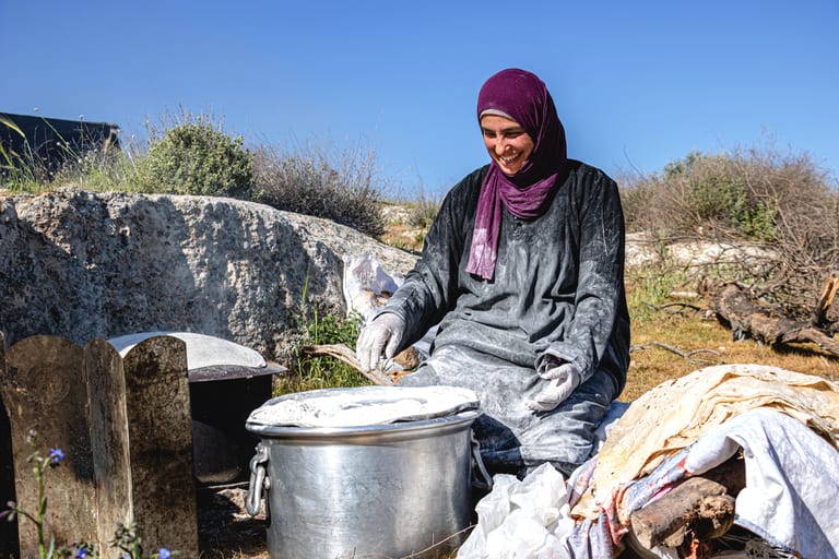 Woman Work Create Bread Outdoor Graesa, a fine-art photograph by Ali Abu Ras