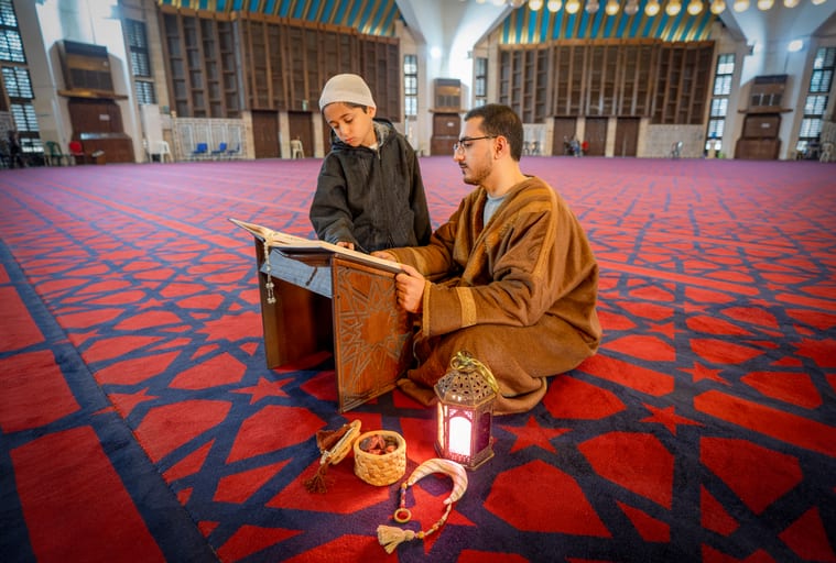 BOY Father Masjed Quran, a fine-art photograph by Ali Abu Ras