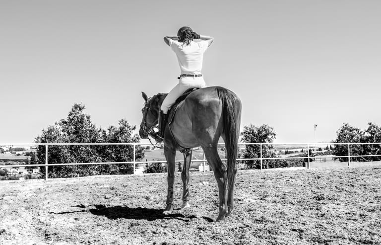 Hours Rider Woman Feild, a fine-art photograph by Ali Abu Ras