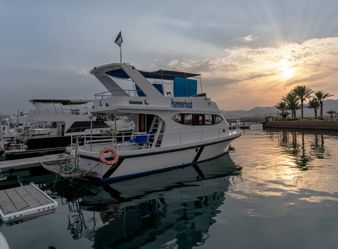 Aqaba SEA Boat Sunset View Landscape, a fine-art photograph by Ali Abu Ras