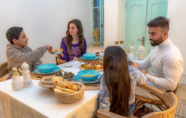 Family Eftar Food Ramadan Table, a fine-art photograph by Ali Abu Ras