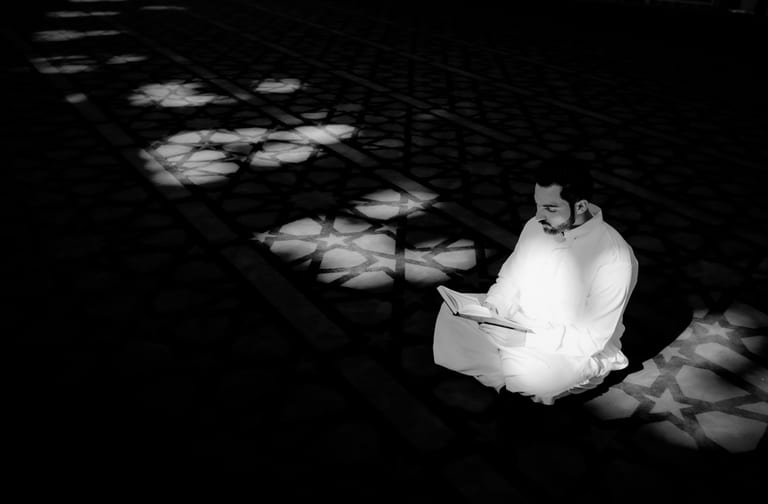 MAN Read Quran Masjid Ramadain, a fine-art photograph by Ali Abu Ras