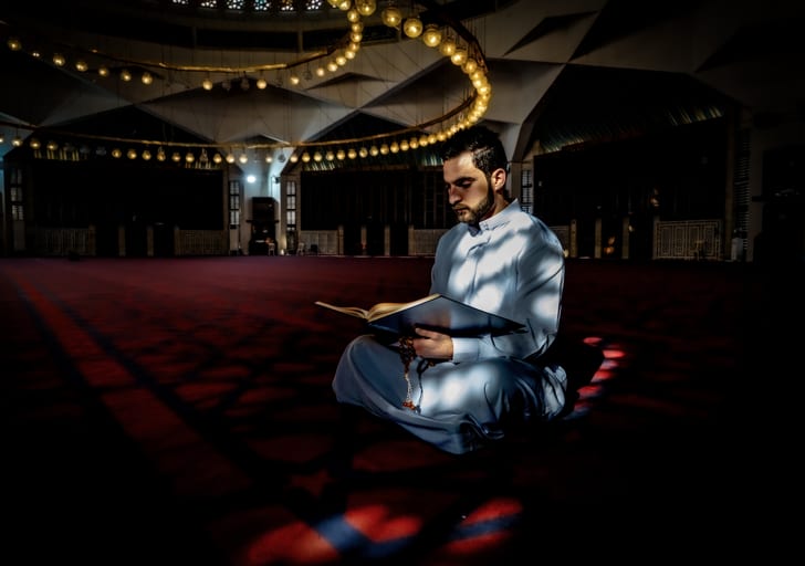 MAN Read Quran Masjid Ramadain Sunlight, a fine-art photograph by Ali Abu Ras